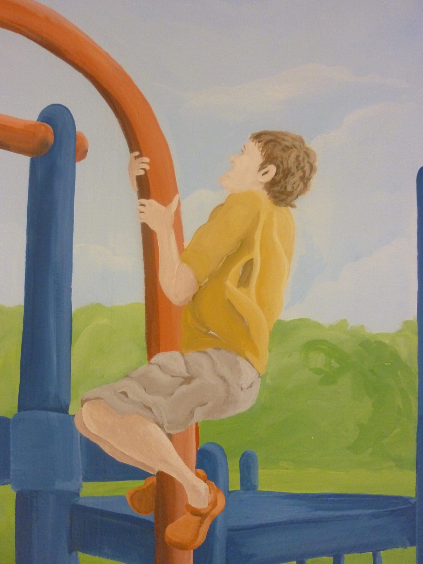 A Boy Playing in a Playground Painting on a Wall